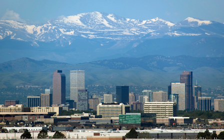 A city with snow covered mountains.