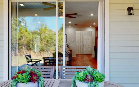 A room with a table and chairs.