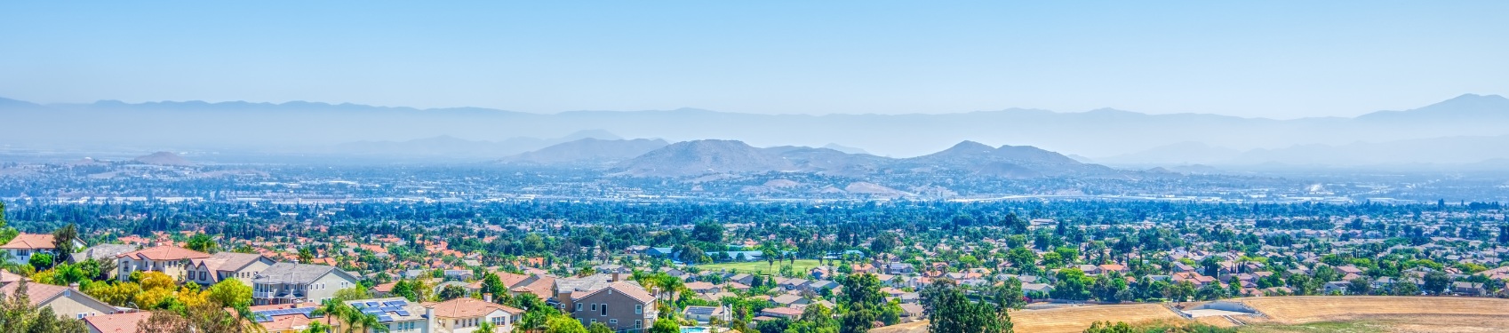A city with mountains in the background.