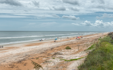 A beach with people on it.