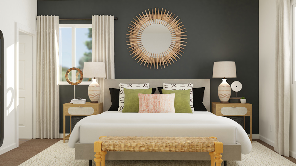 A bed with a round mirror.