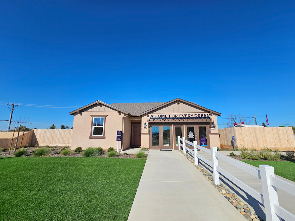 A building with a white fence.