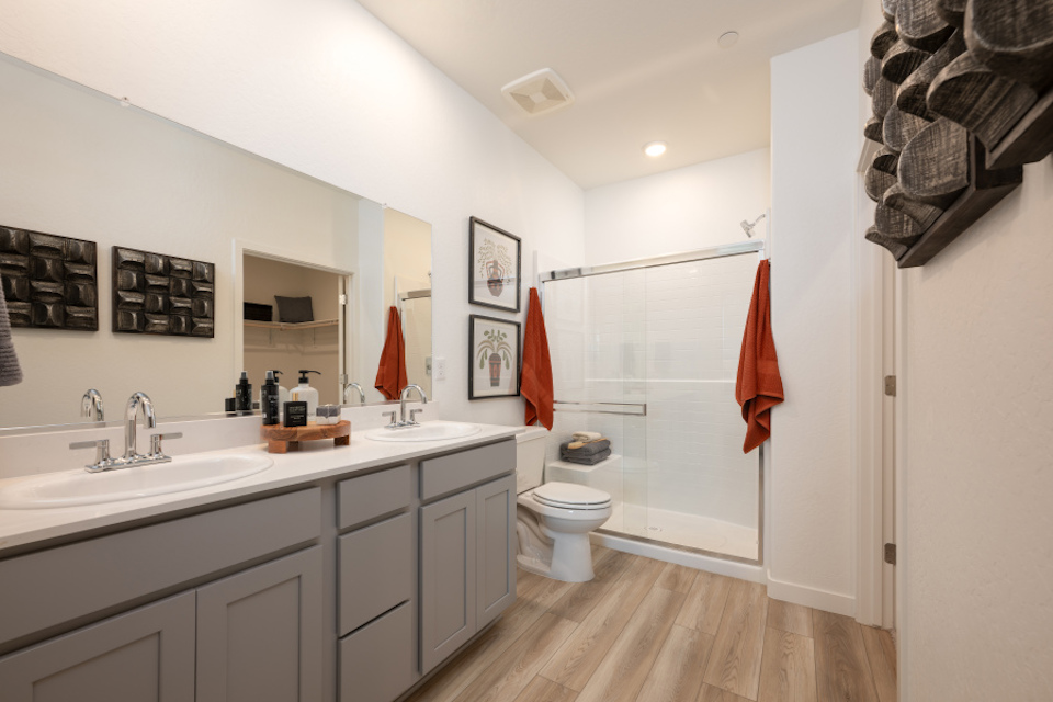A bathroom with a shower and toilet.