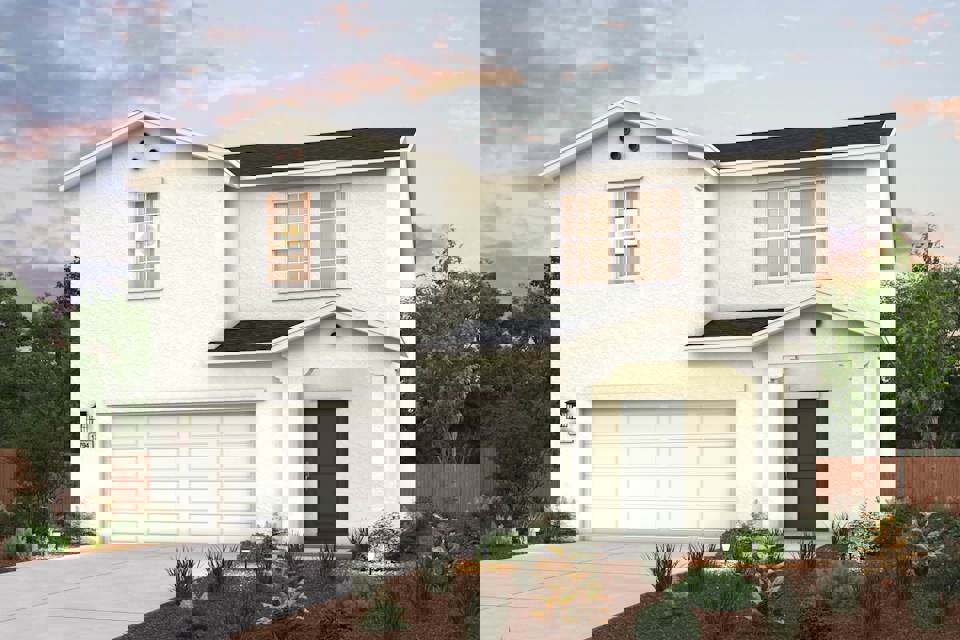 A white house with a garage.