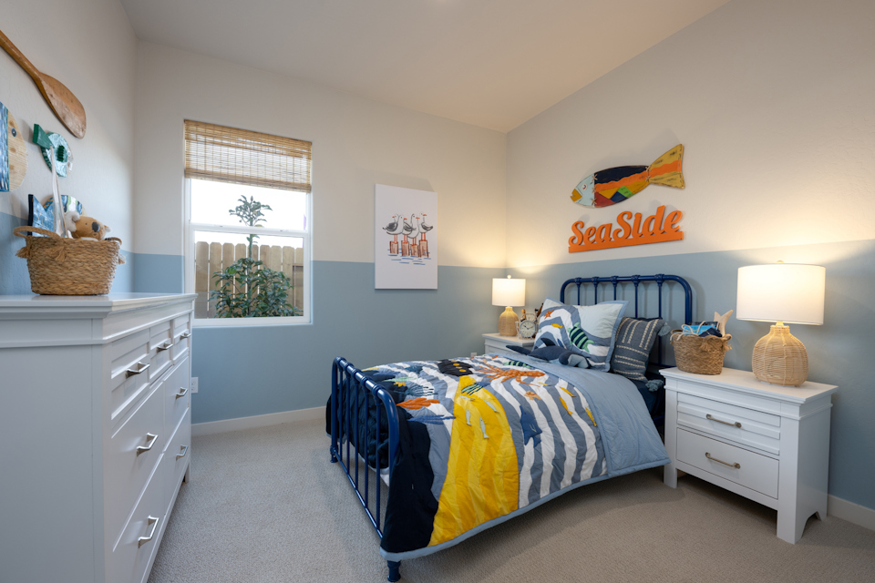 A bedroom with a bed and a window.