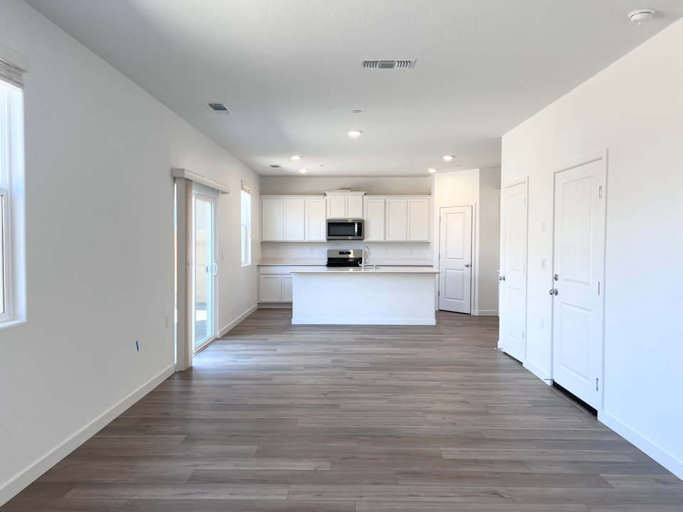 A room with white cabinets.