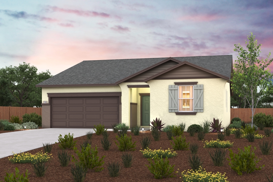 A house with a driveway and a garden in front of it.