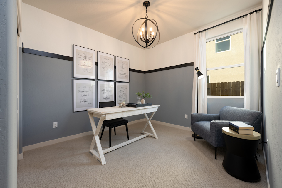 A room with a table and chairs.