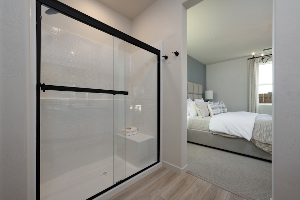 A bedroom with a glass door.