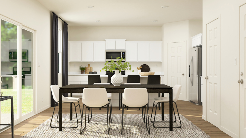 A room with a table and chairs.