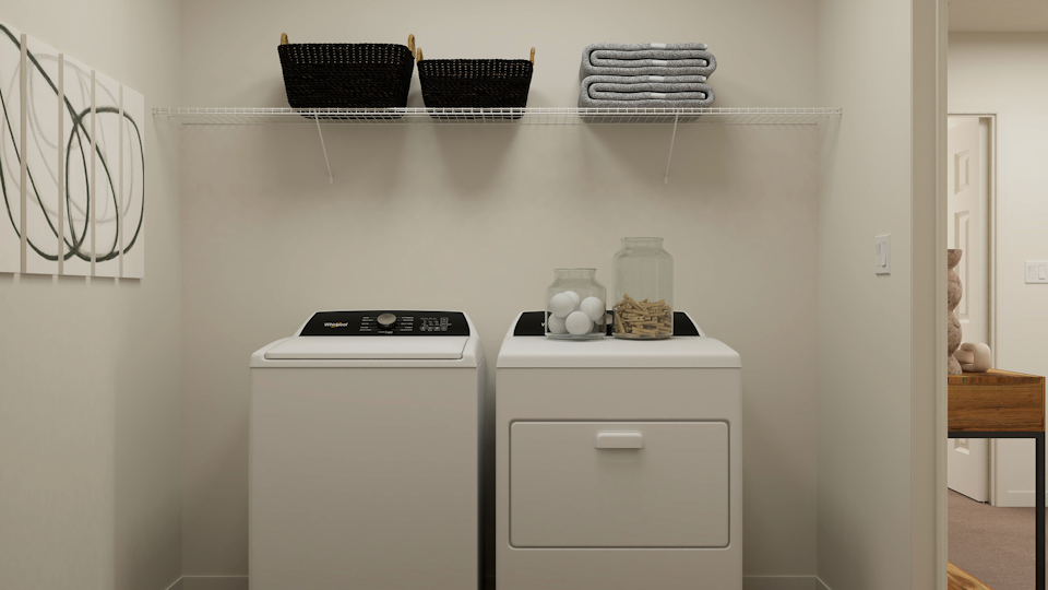 A white laundry room with a white washer and dryer.