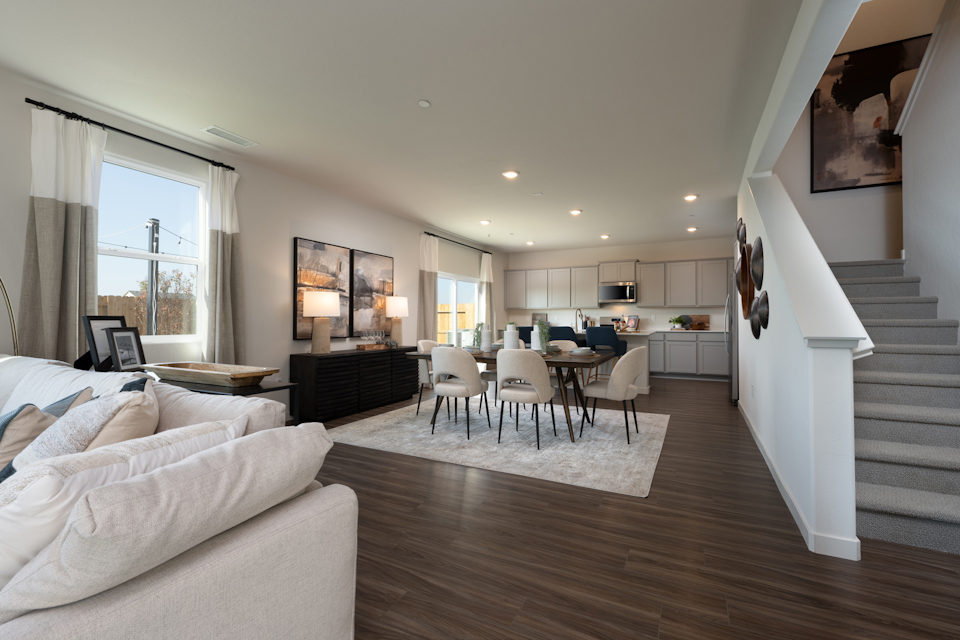 A living room with a wood floor.