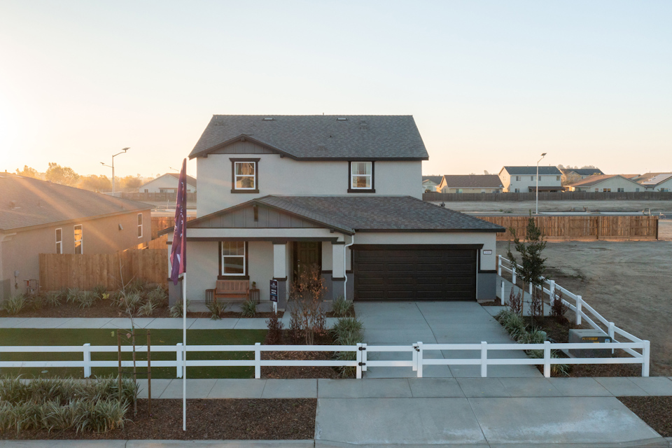 A house with a white fence.