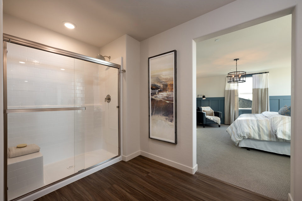 A bedroom with a glass door.