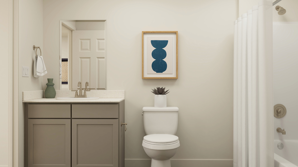 A bathroom with a toilet and a sink.