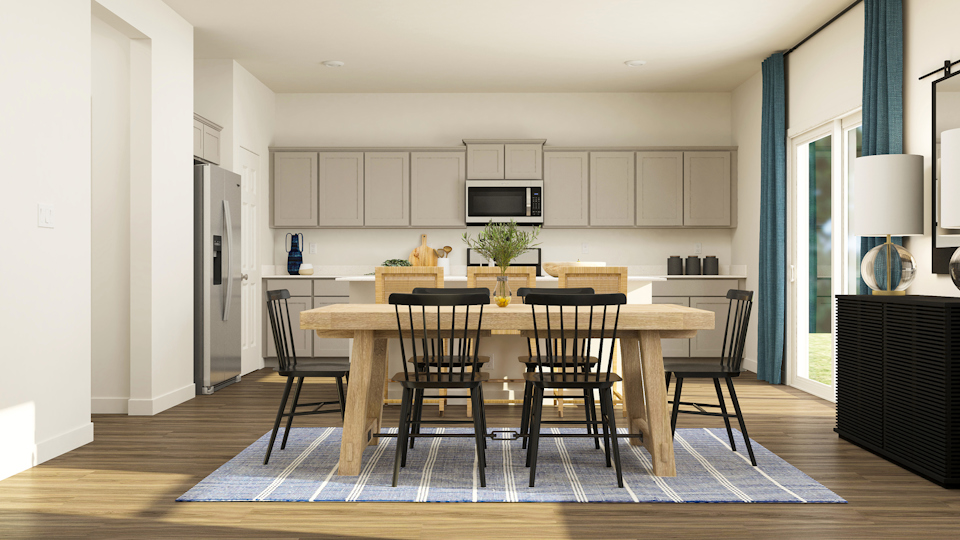 A kitchen with a dining table and chairs.