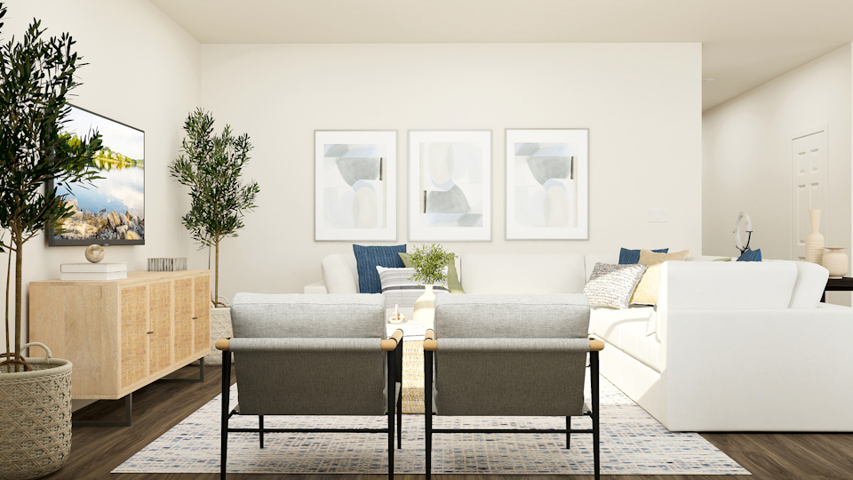 A living room with a couch and a table.