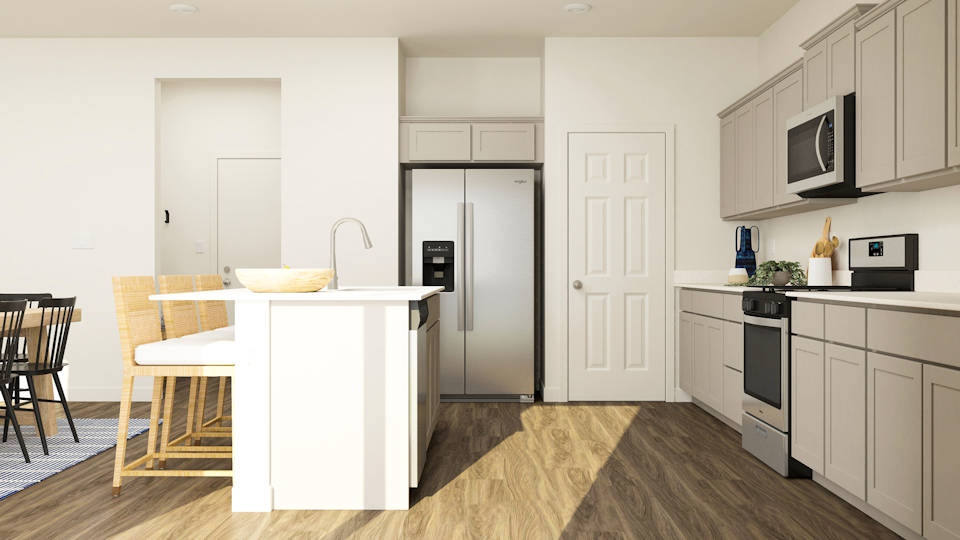 A kitchen with white cabinets.