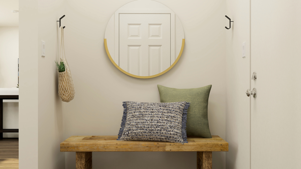 A table with a mirror and a basket on it.