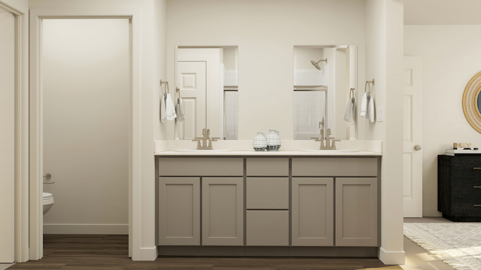 A bathroom with a large mirror.