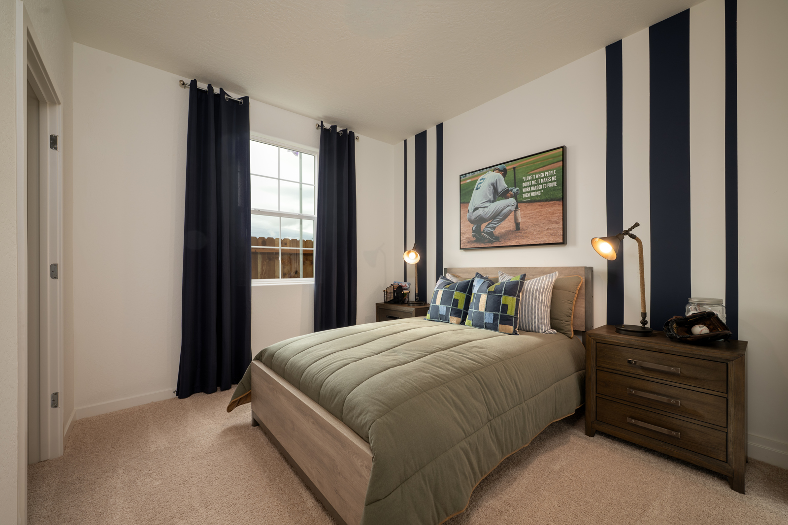 A bedroom with a bed and a dresser.