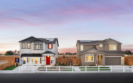 A house with a white picket fence.