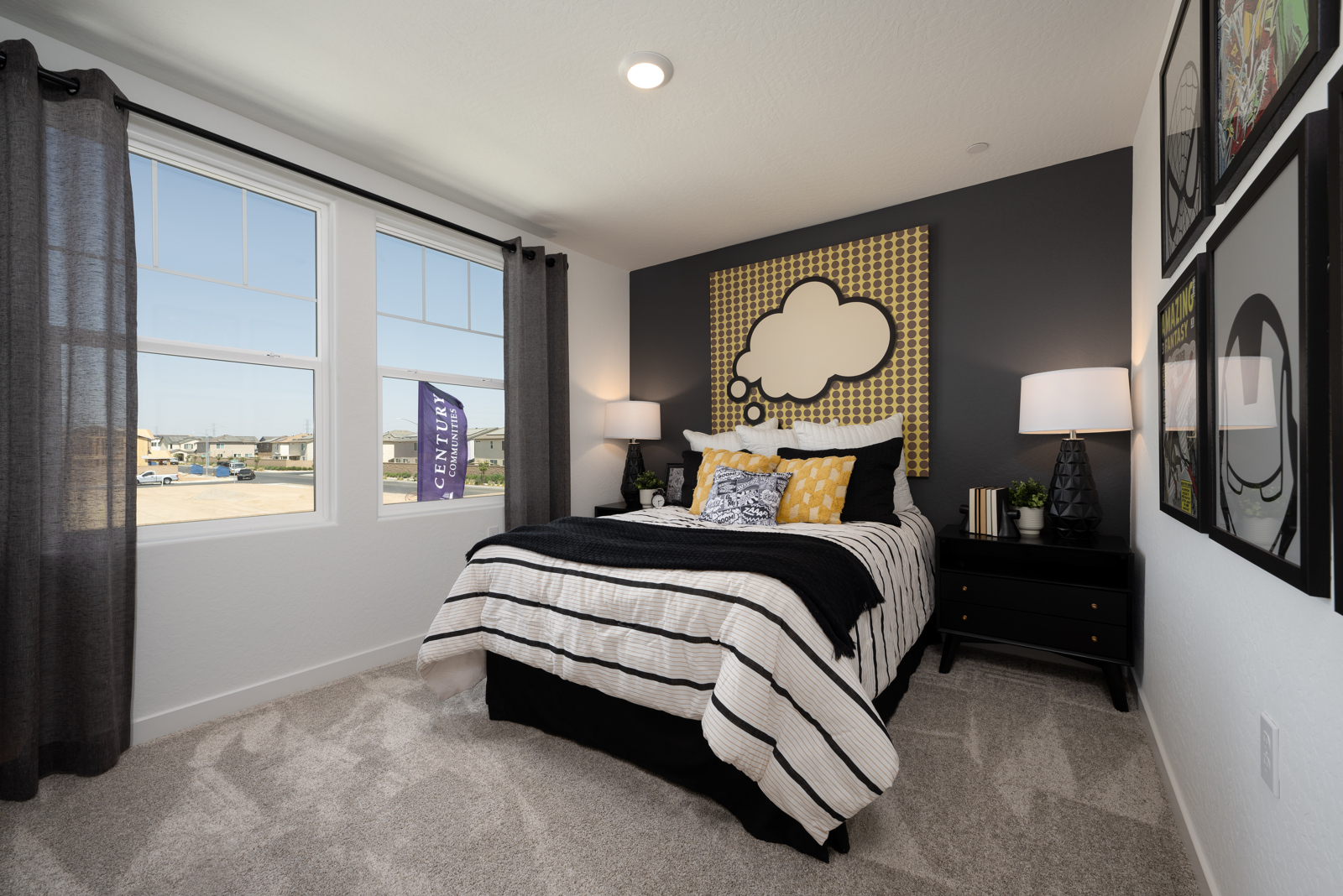 A bedroom with a large window.