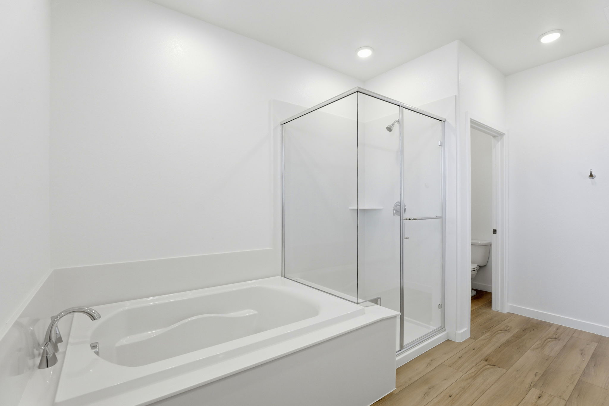 A bathroom with a glass shower.