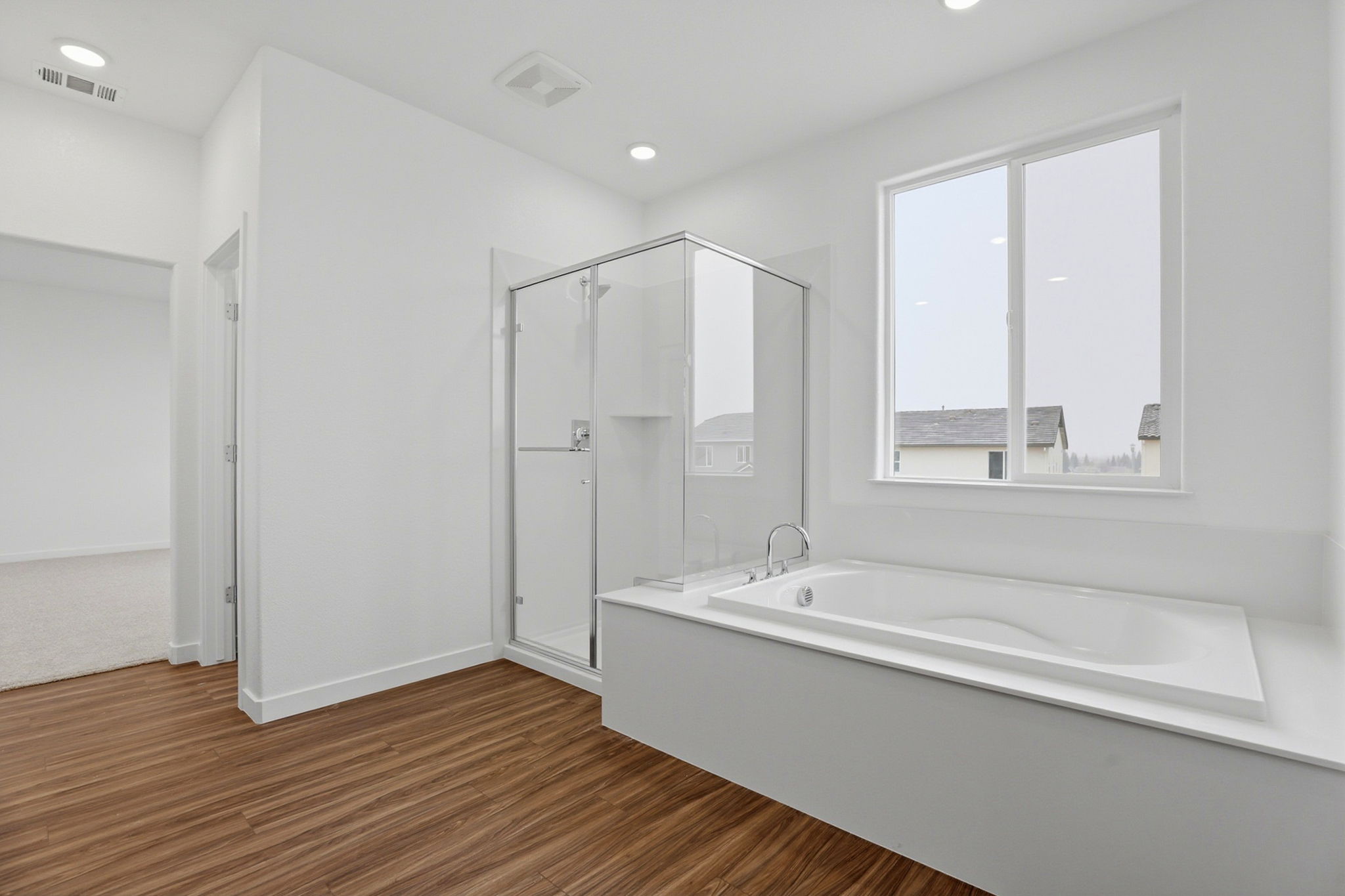 A bathroom with a tub and sink.
