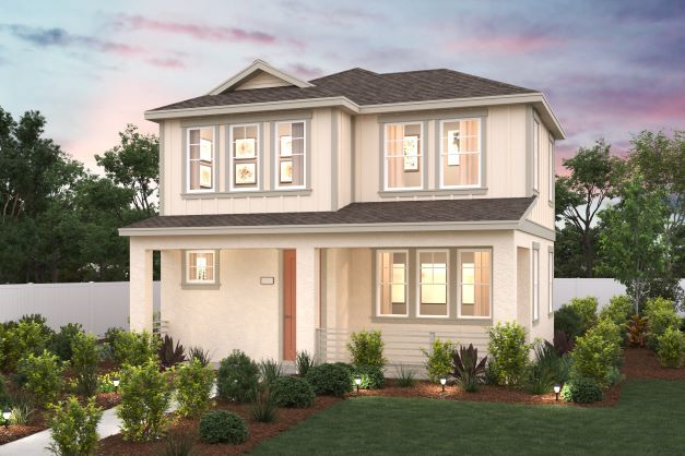 A house with a lawn and trees with Emily Carr House in the background.