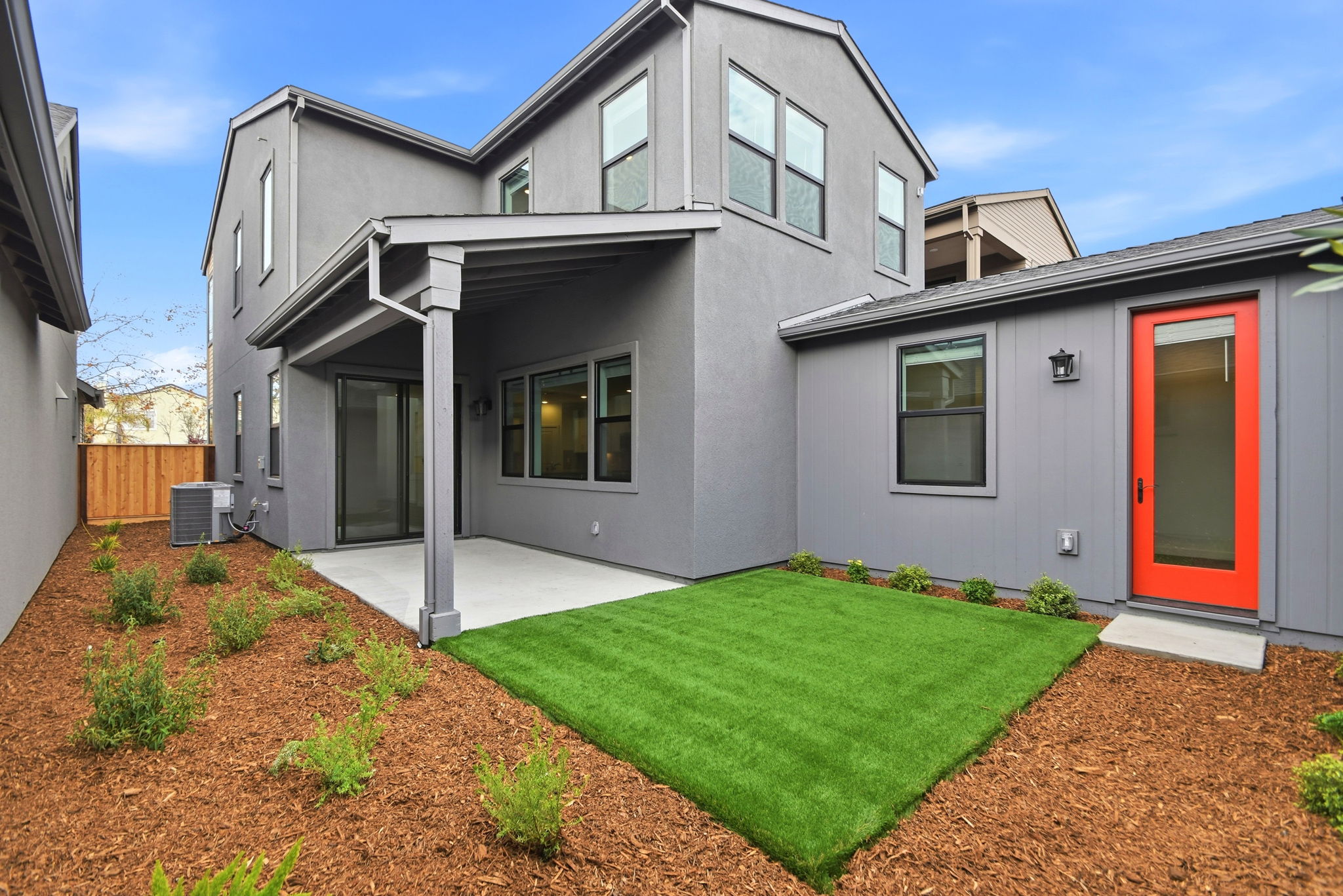 A house with a green lawn.