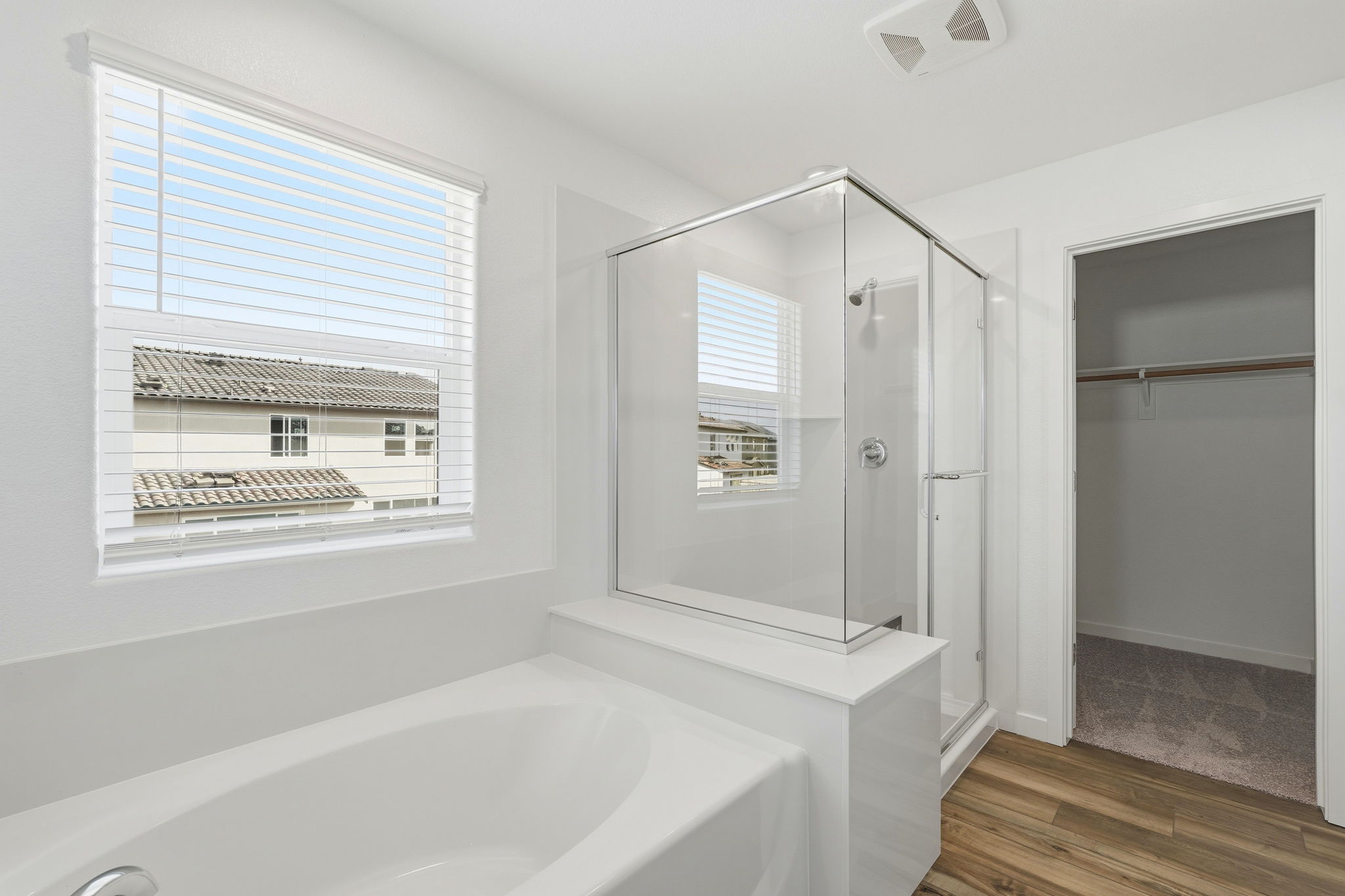 A bathroom with a tub and shower.
