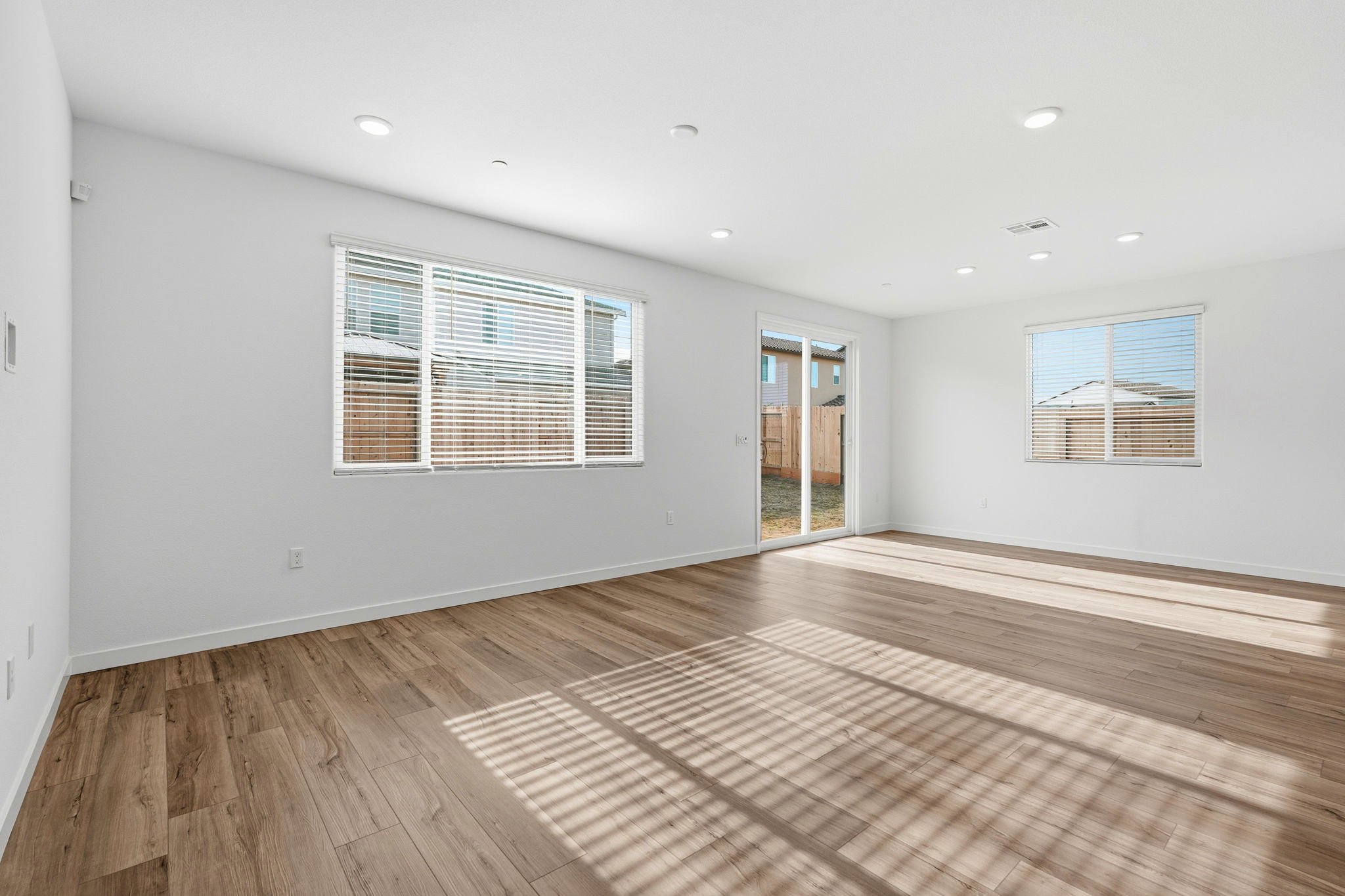 A room with a wood floor and a wood floor.