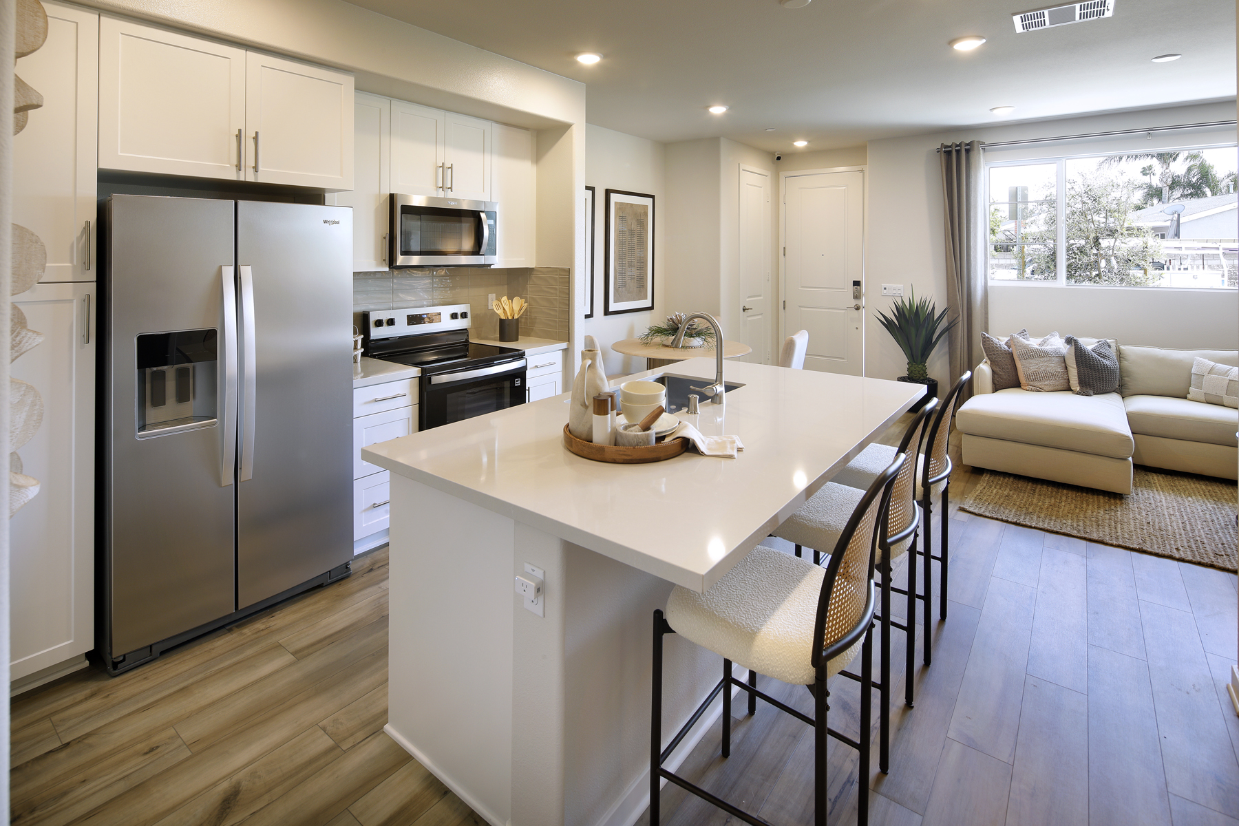 A kitchen with a dining table.
