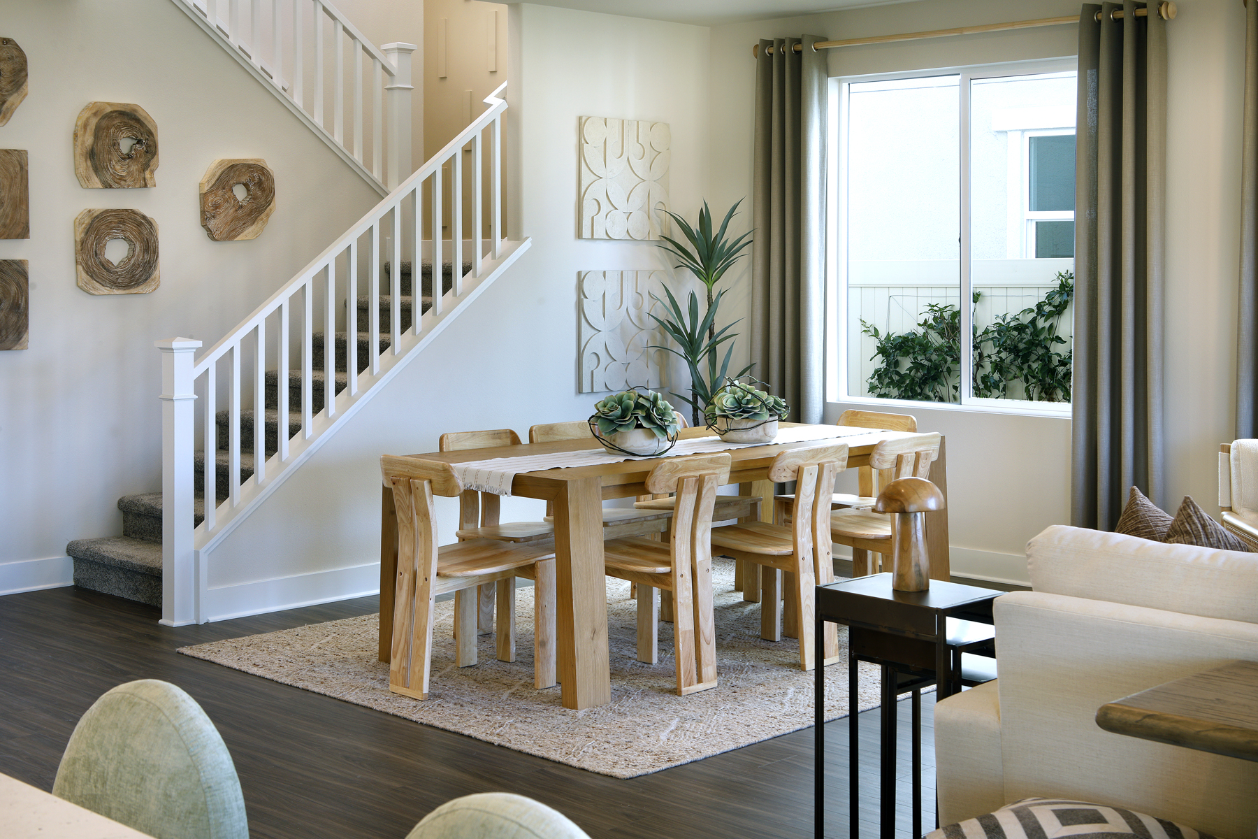 A living room with a staircase.