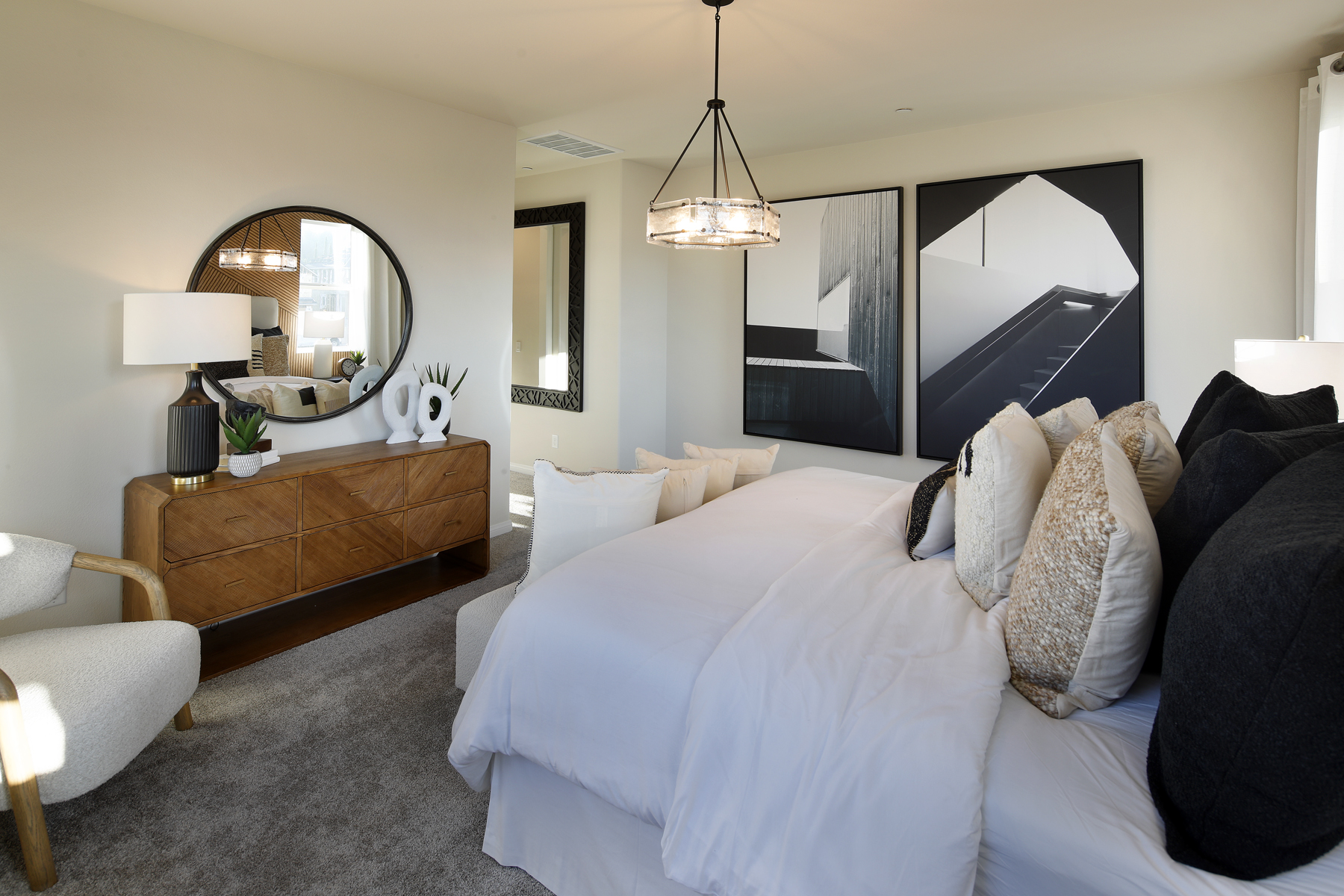 A bedroom with a bed and a couch.