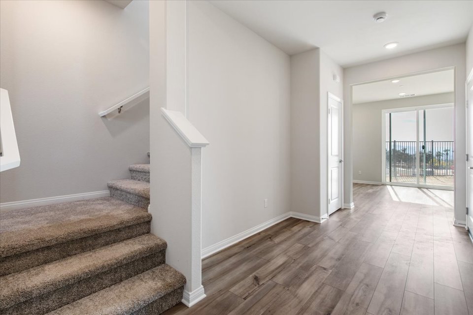 A room with a wood floor and a wood floor.