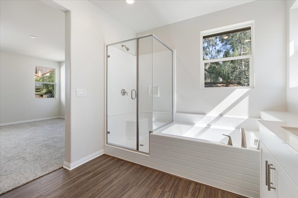A bathroom with a glass shower.