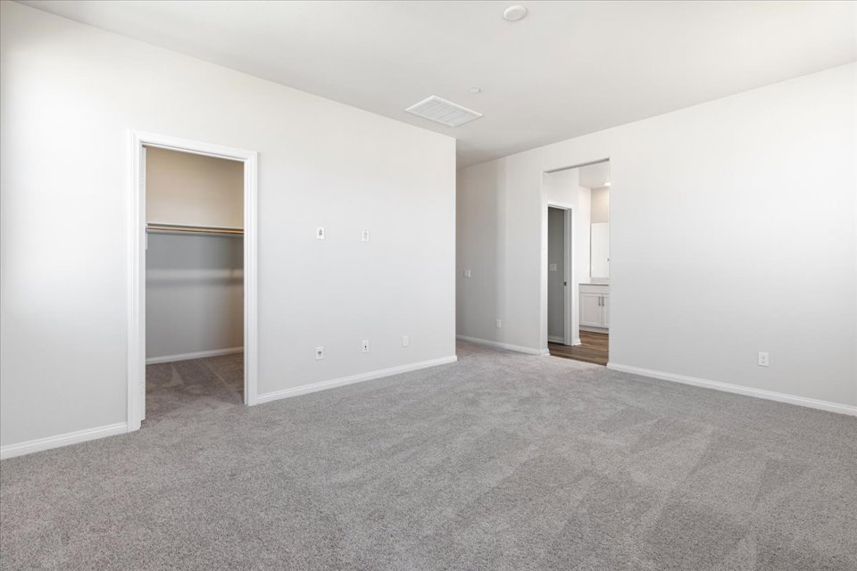 A hallway with a door.