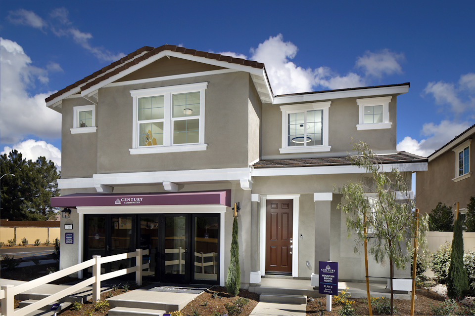 A white house with a fence.