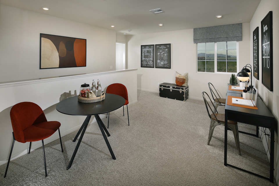 A room with a table and chairs.