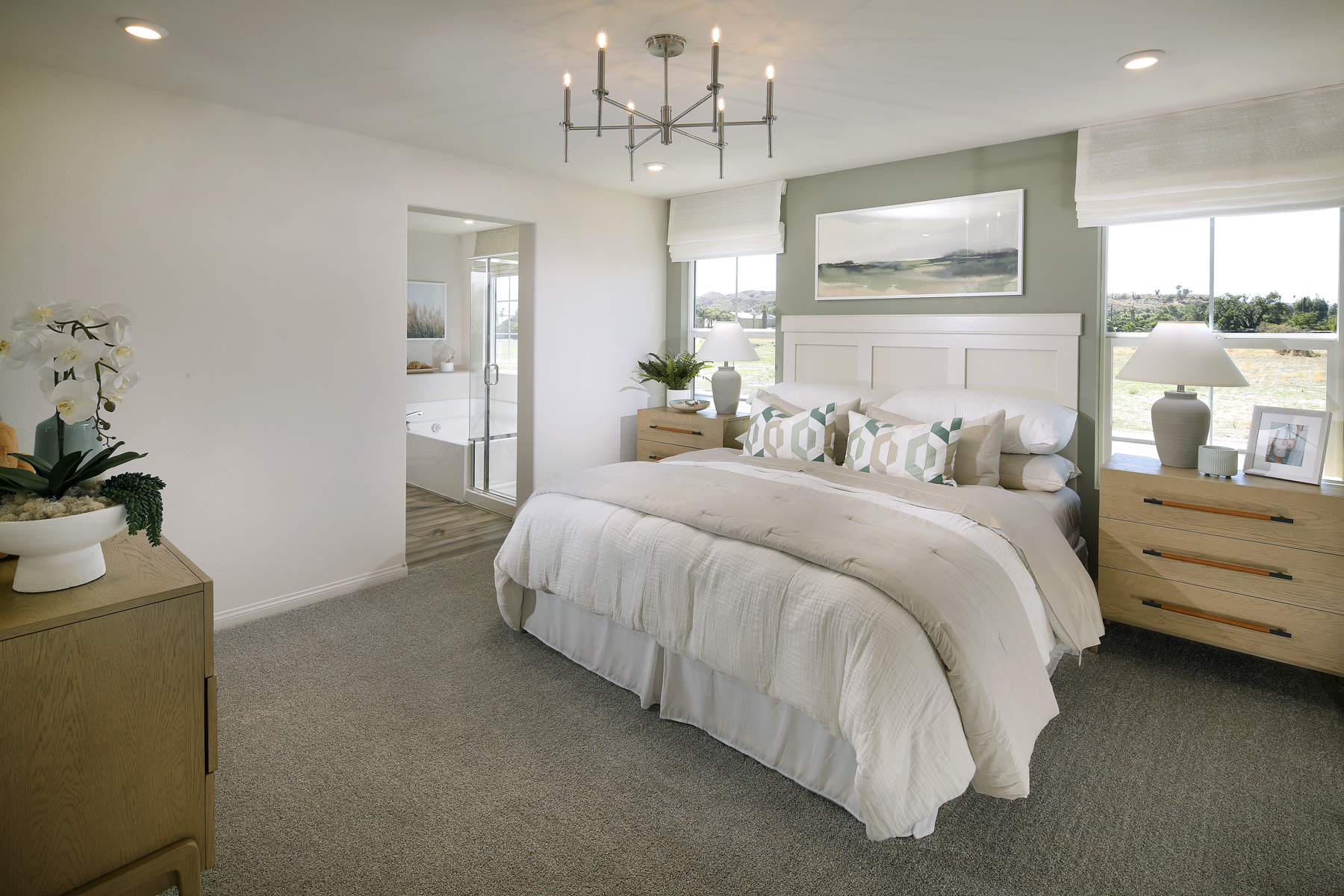 A large bed with white sheets.