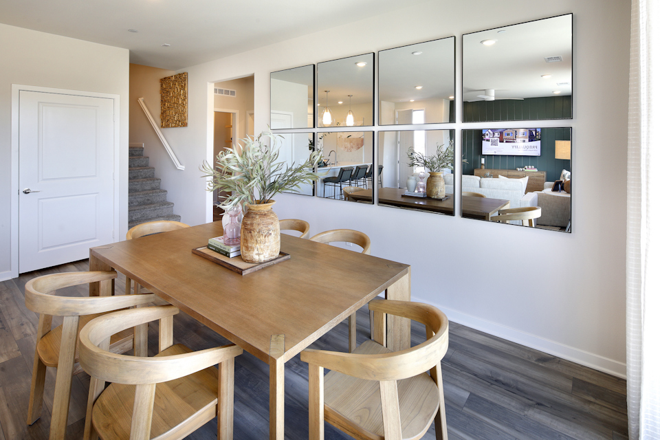A dining room table with chairs.