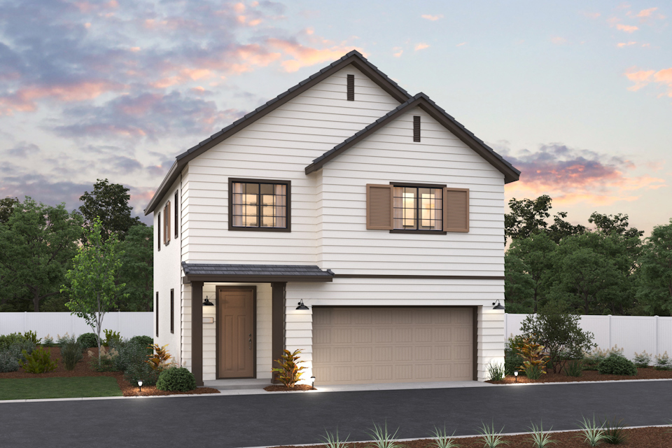 A white house with a garage.