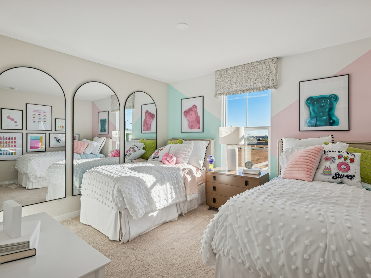 A bedroom with two beds.