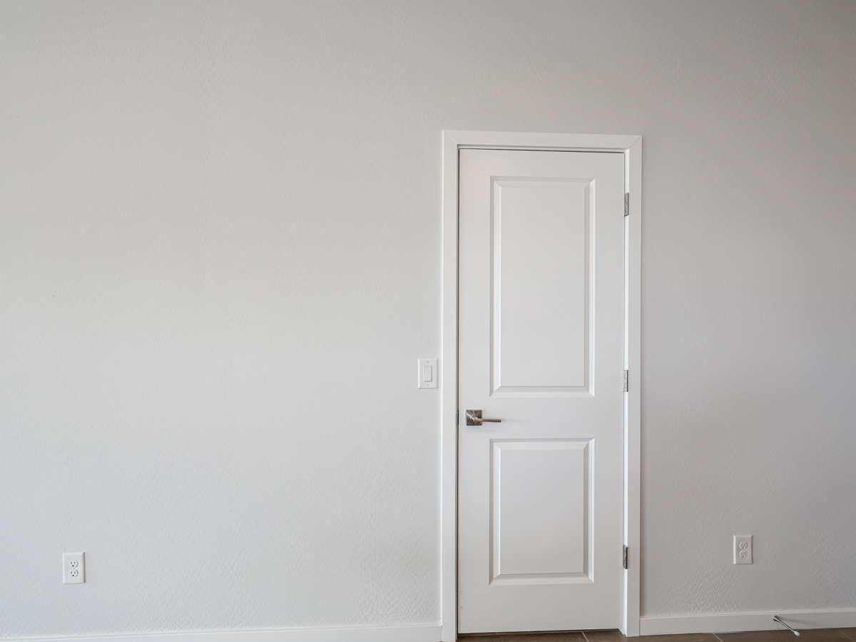 A white door in a room.
