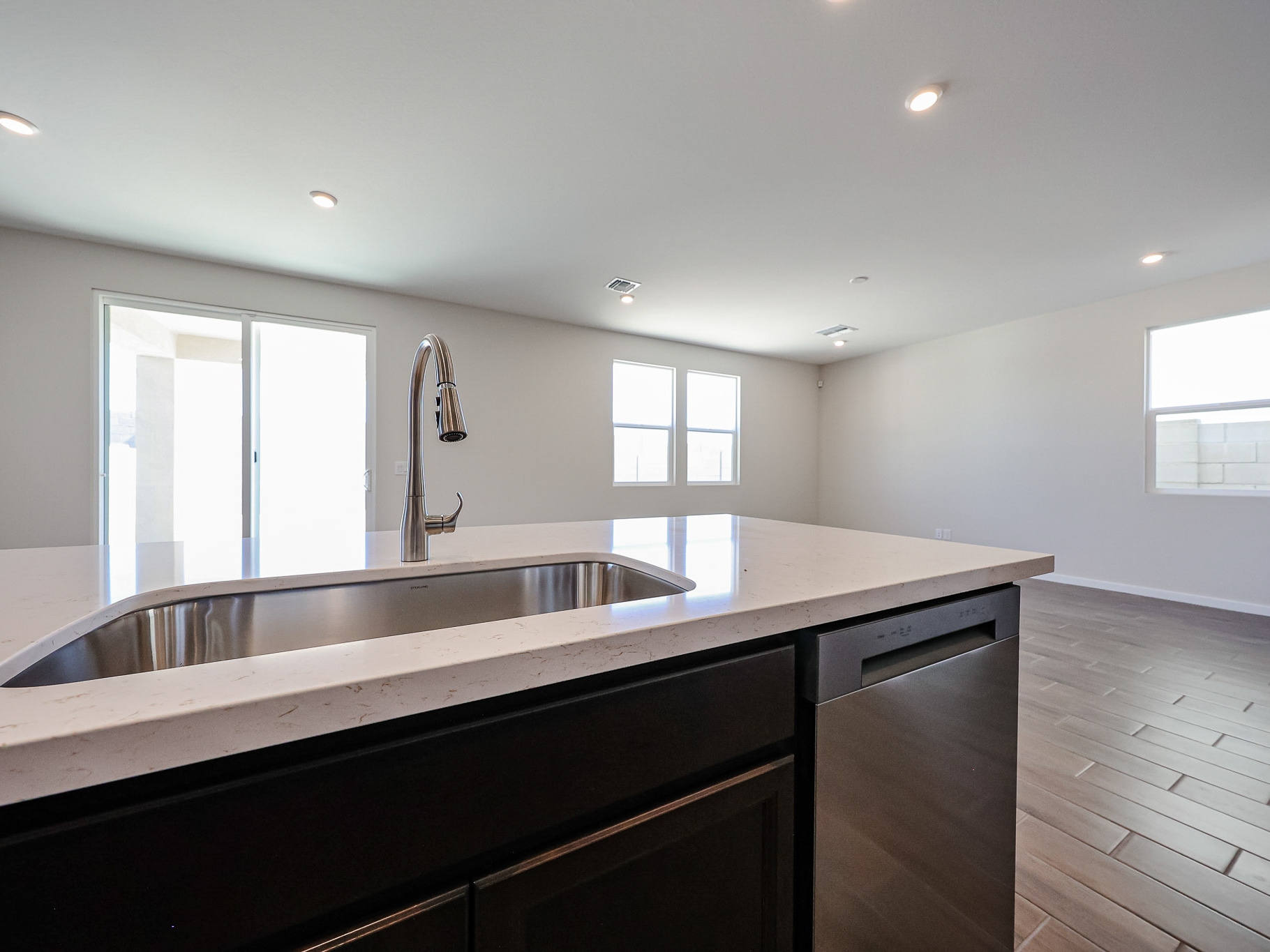 A kitchen with a marble countertop.