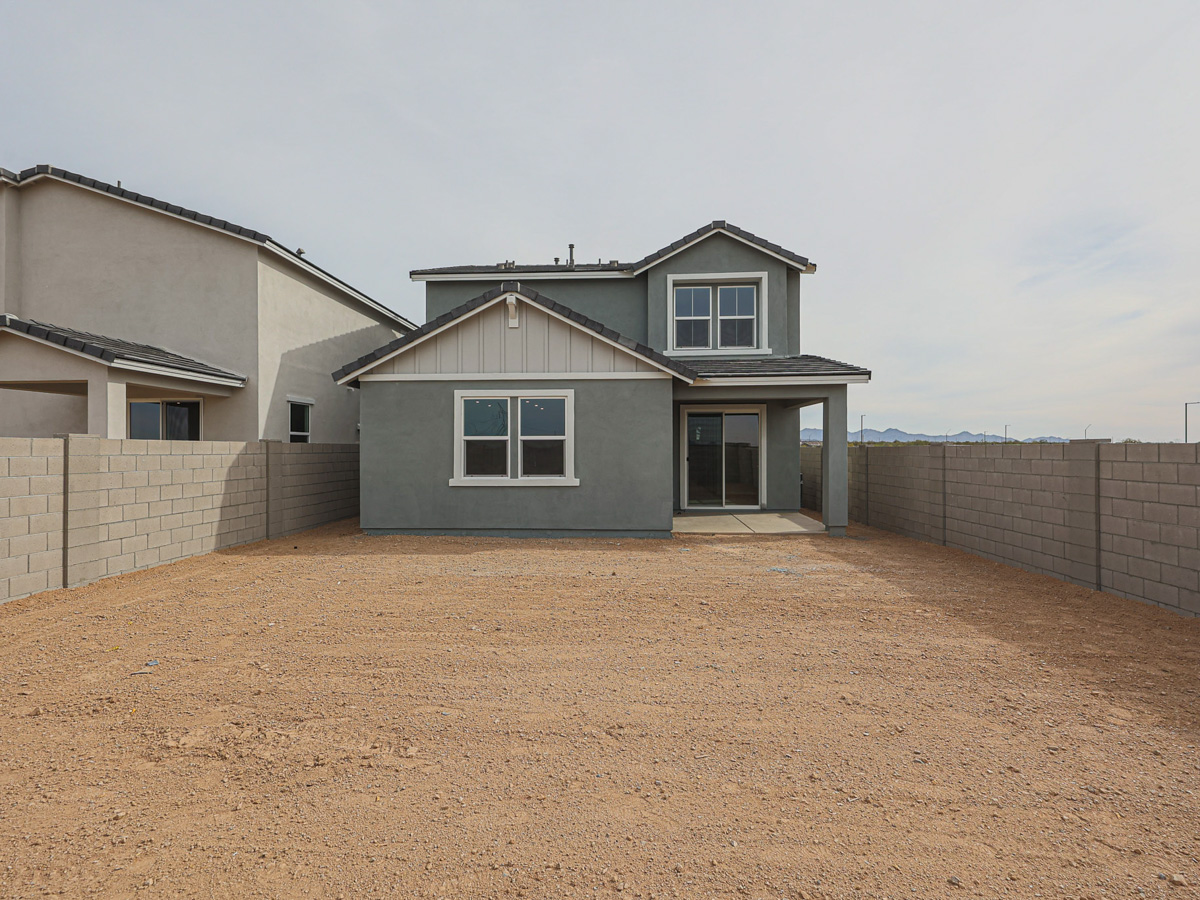 A house with a dirt yard.