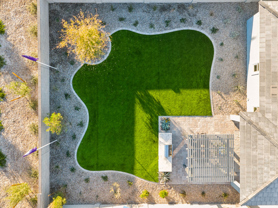 A building with a large green field.