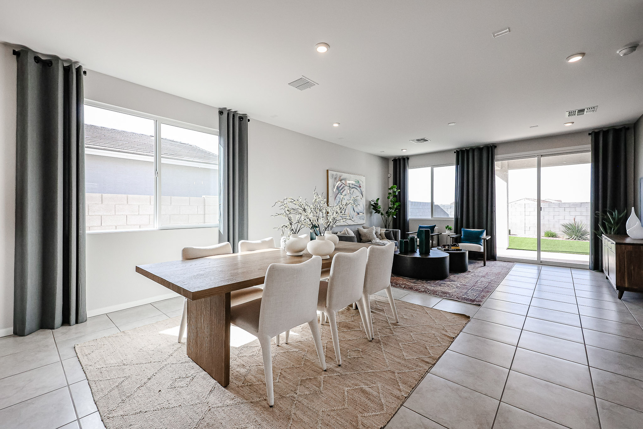 A dining room with a large window.